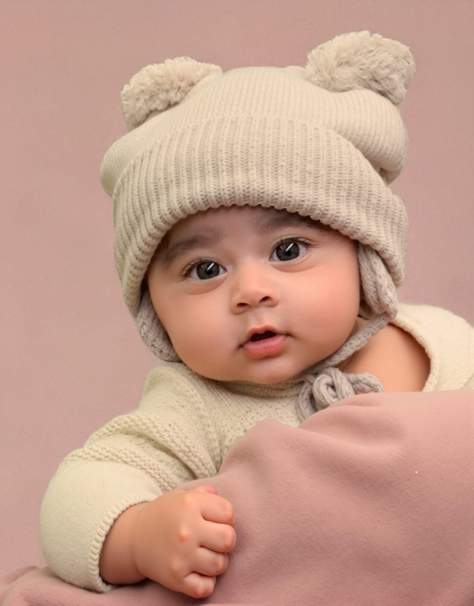 Arya in a knitted bear beanie with little ears